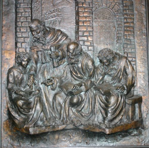 Bas relief représentant Jésus au Temple en train de questionner les docteurs de la loi.