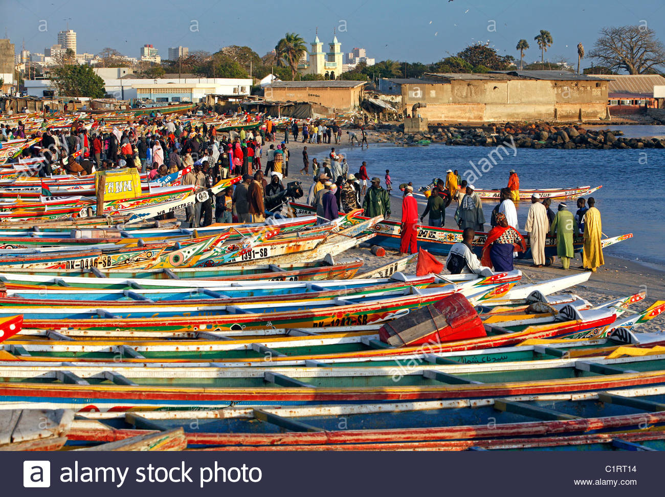 colorfully-painted-fishing-boats-line-the-beach-at-the-fish-market-C1RT14.jpg