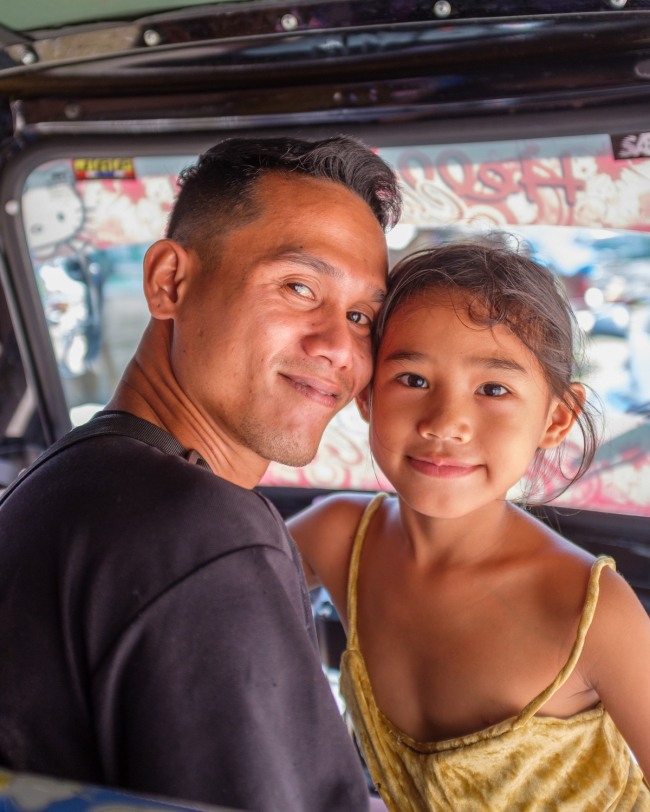 Mindanao. Dapitan, our tricycle driver and his daughter. September 2022