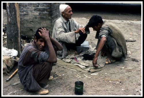 North India. Kashmir, a hair cut in the street.1977