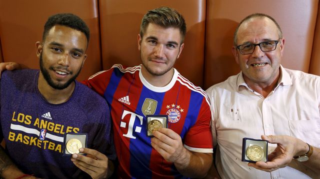 sadler-sharlatos-and-norman-three-men-who-helped-to-disarm-an-attacker-on-a-train-from-amsterdam-to-france-pose-with-their-medals-at-a-restaurant-in-arras-france_5401387.jpg