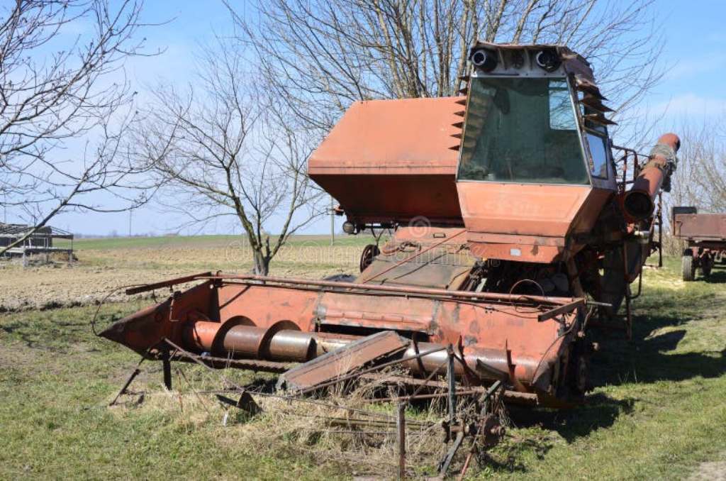 old-rusty-disassembled-combine-harvester-soviet-niva-zdolbuniv-rivne-region-ukraine-april-stands-joke-defective-lot-216078088.jpg