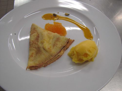 Crêpe soufflée aux mandarines et sorbet