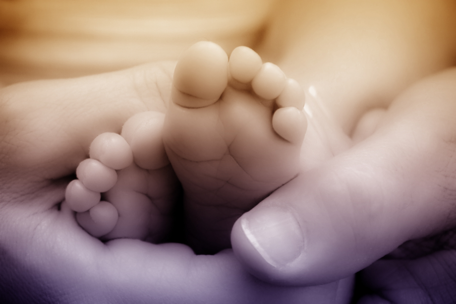 stockvault-newborn-baby-feet-in-mothers-hands230997.jpg