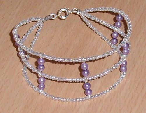 Bracelet multirangs en fil câblé, perles miracles et rocailles