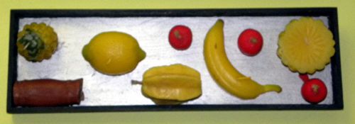 Tableau de bougies-fruits en relief