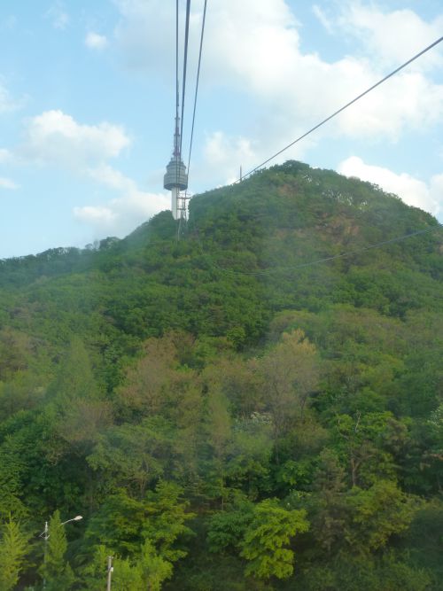 Seoul Tower, in the middle of the town where you can have a nice view on the city ... the Korean Eiffel Tower ! 