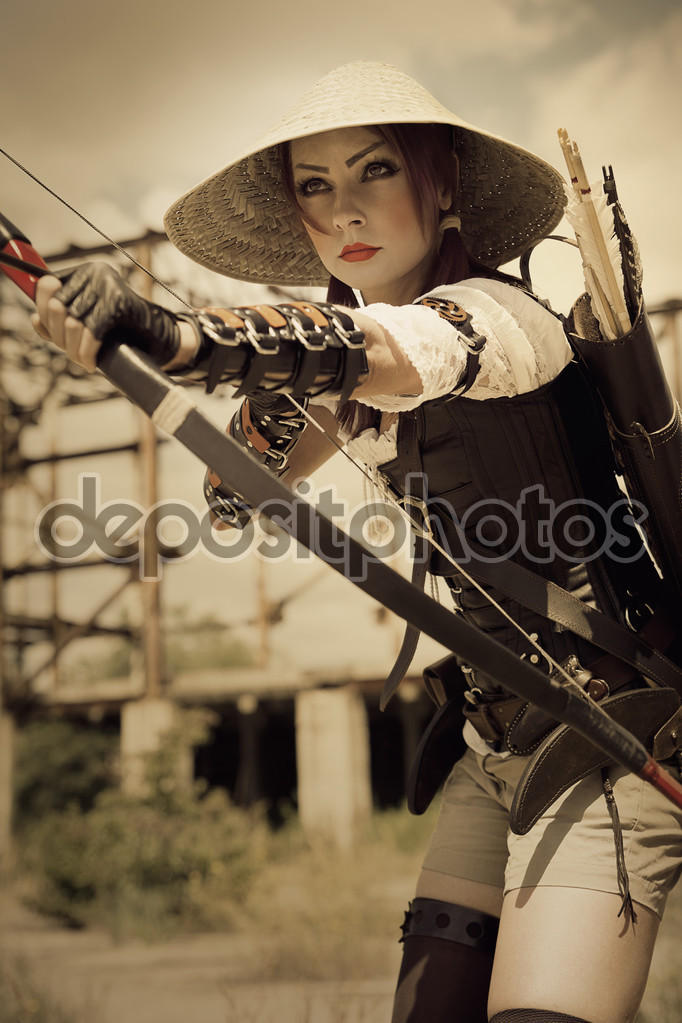 depositphotos_64810259-Attractive-woman-warrior-holding-in.jpg