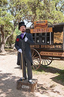 Snake-oil_salesman_Professor_Thaddeus_Schmidlap_at_Enchanted_Springs_Ranch,_Boerne,_Texas,_USA_28650a